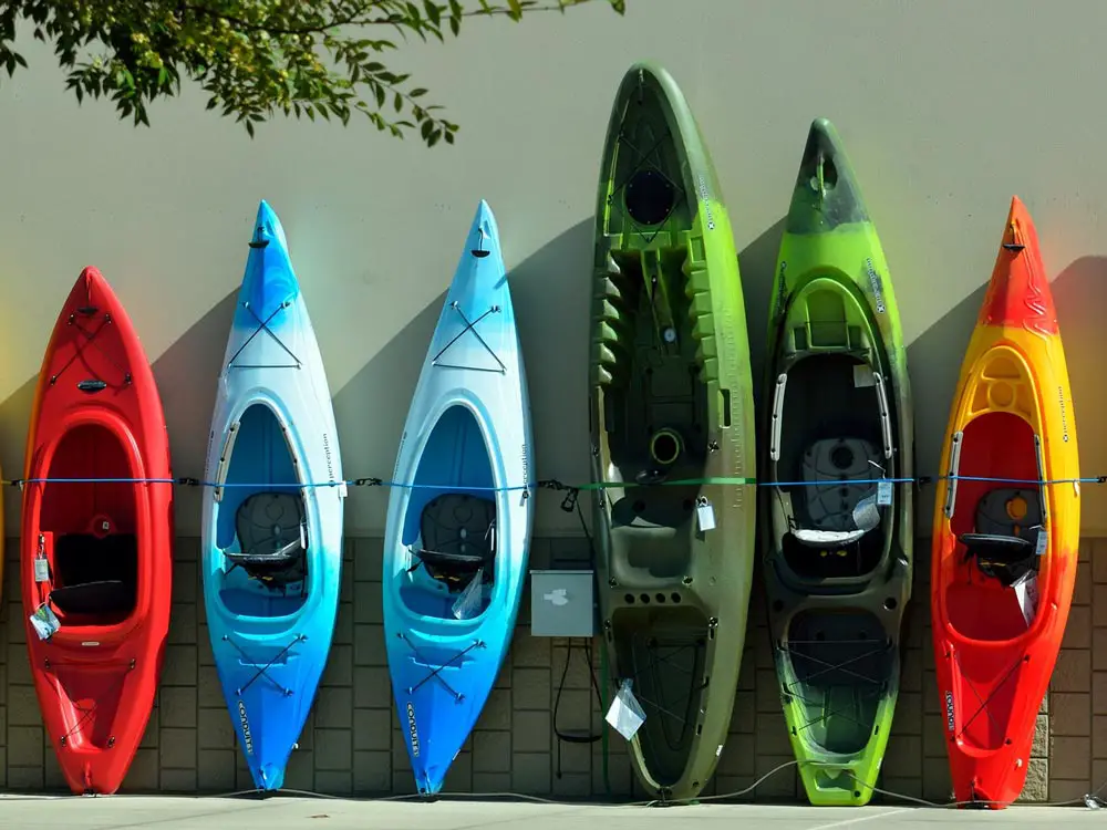 A range of modern kayaks, both sit inside and sit on top.