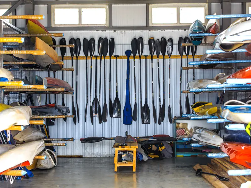 Kayak paddles hanging on a wall