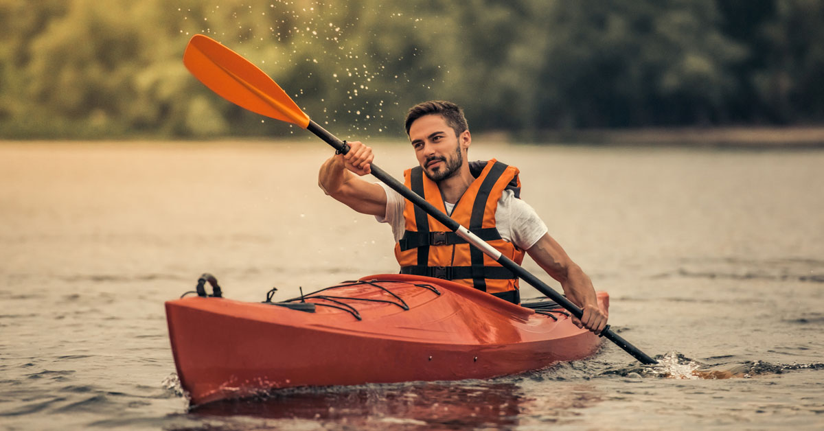 How fast can you paddle a kayak. Photo of a man paddling
