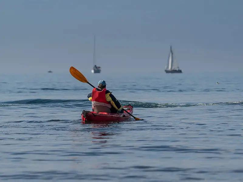 A kayaker paddling alone