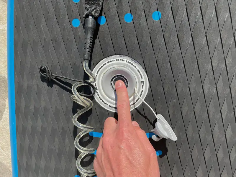 Opening the valve on a SIC Airglide RS inflatable paddle board