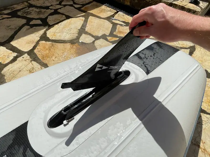 removing the fin from a US fin box on a SIC  Airglide RS inflatable paddle board