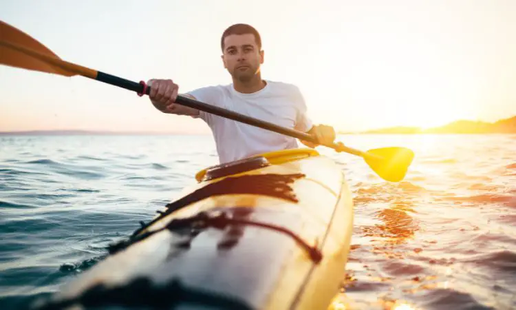 When deciding what to wear while kayaking, what should you keep in mind?
