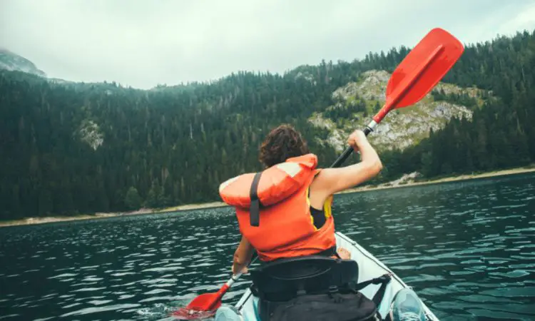 When deciding what to wear while kayaking, what should you keep in mind?