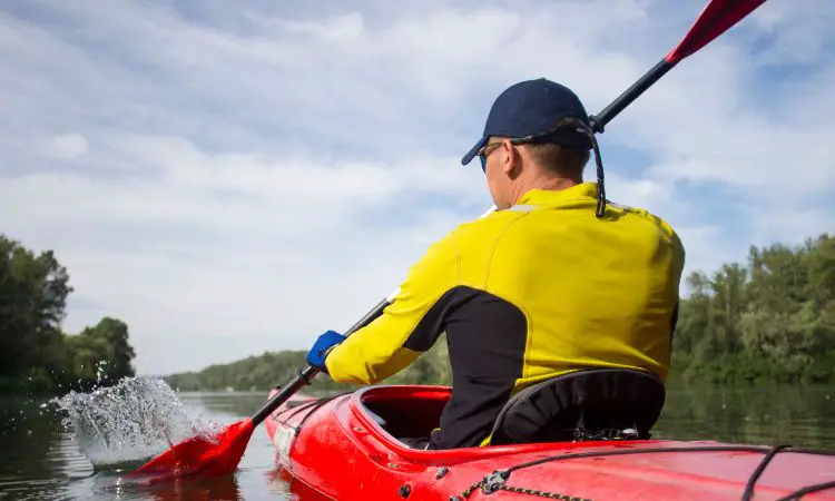 When deciding what to wear while kayaking, what should you keep in mind?